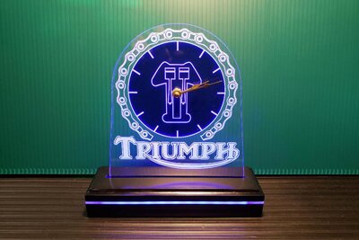 Custom engraved clock with Triumph motorcycle logo from Engraver's Den